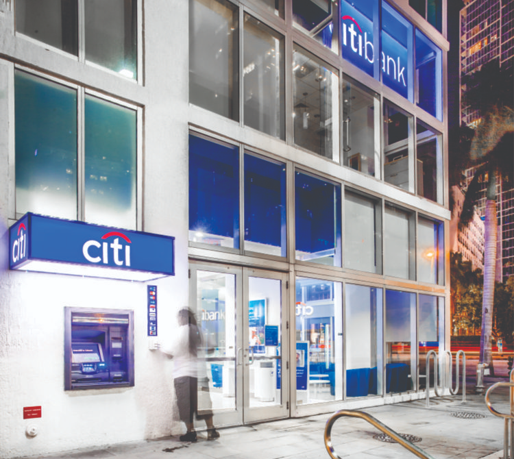 Citi Bank signs and graphics, glass building on street corner, bank signage