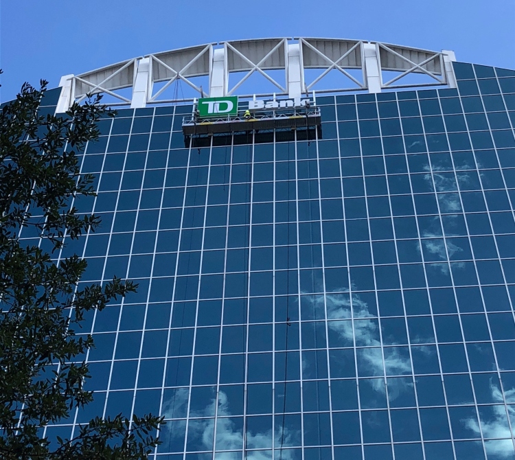 td bank high-rise signage on glass building