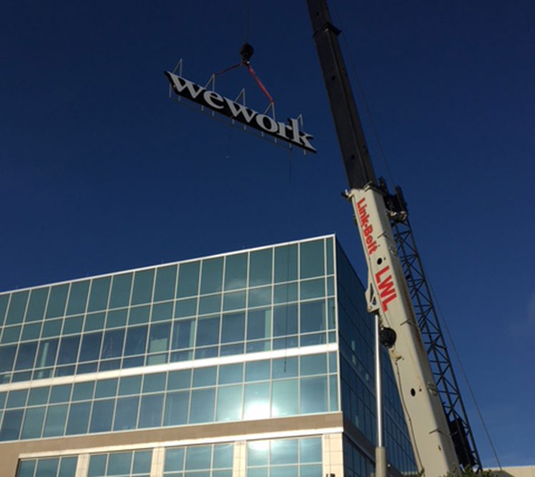 high-rise sign being installed